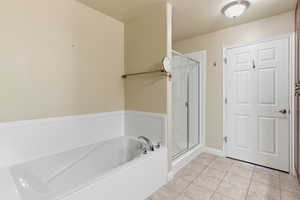 Ensuite bathroom with separate tub and shower