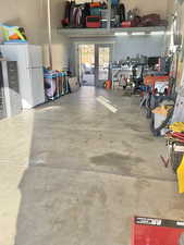 Garage with freestanding refrigerator