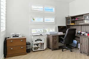Office space featuring light wood-style floors