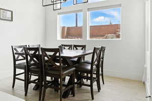 Dining room featuring light wood finished floors and baseboards