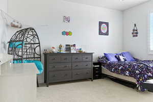 Bedroom with light carpet