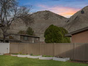 View of yard featuring a garden and a mountain view