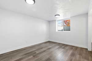 Empty room featuring light wood-style flooring and baseboards