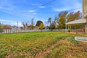 Fenced backyard with a patio