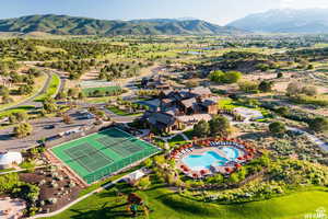 Aerial view of a mountain backdrop and a pool