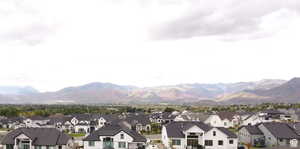 View of mountain backdrop with nearby suburban area