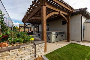 Custom design pergola and stone flower bed