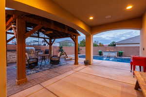 Covered patio and outdoor kitchen area