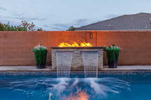 Waterfall and fire pit feature.
