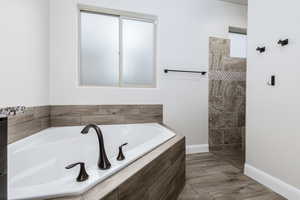 Owners suite bathroom tub and walk in shower