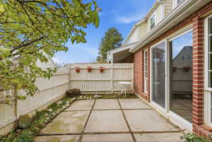 Fenced backyard featuring a patio area