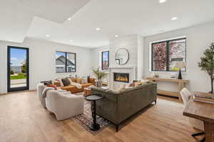 Main level entrance into a cozy family room with gas fireplace, 3 bedrooms, 2.5 baths, mudroom/laundry and direct garage access.