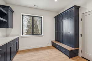 Mudroom with lockers to hang the coats and gear while you sit and take off your shoes. Direct access from garage or main level
