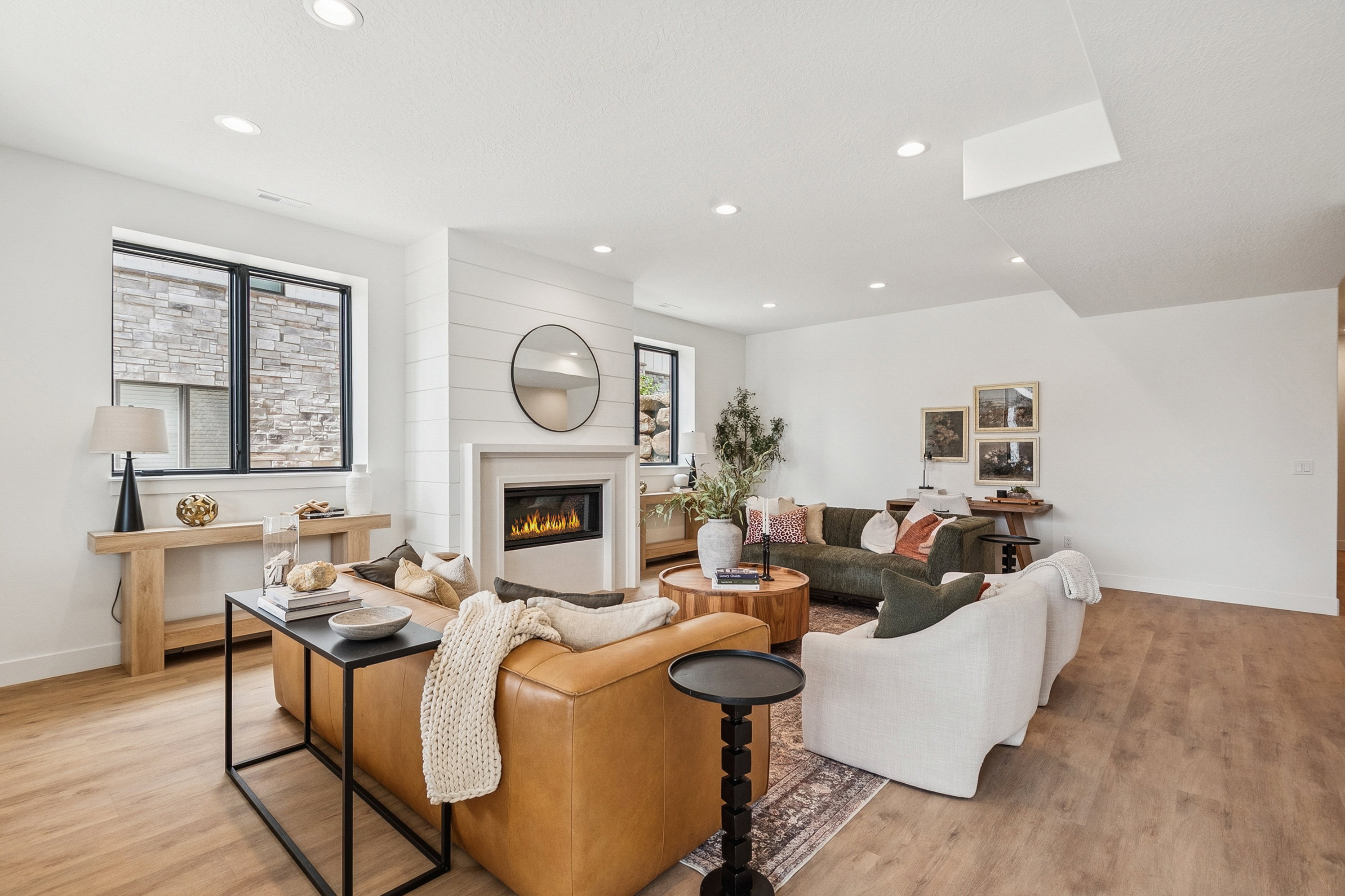 Main level entrance to a cozy family room with gas fireplace, 3 bedrooms, 2.5 baths, mudroom/laundry and direct garage access.