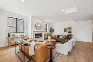 Main level entrance to a cozy family room with gas fireplace, 3 bedrooms, 2.5 baths, mudroom/laundry and direct garage access.