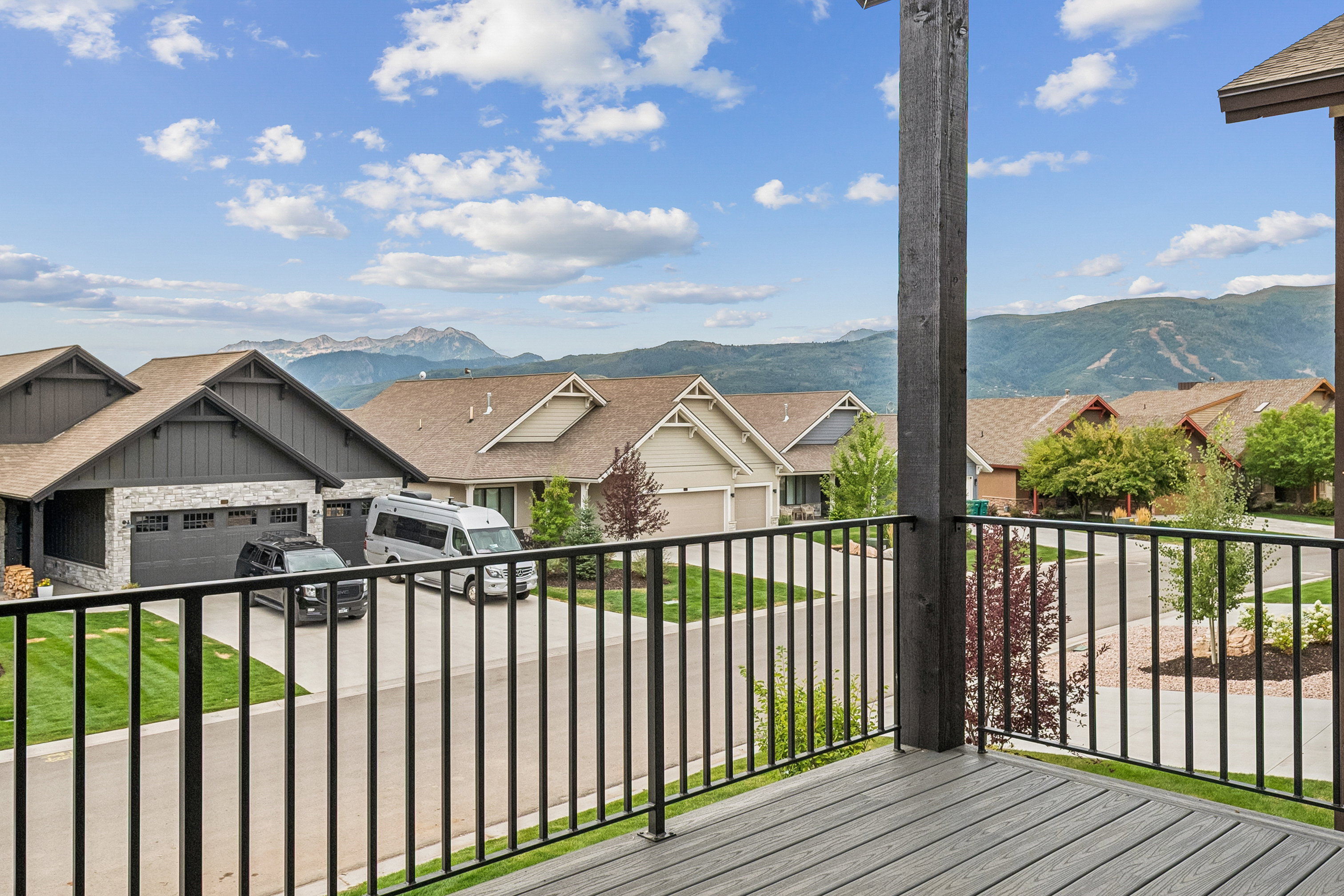 Deck featuring a mountain and valley view