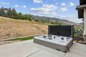 View of back patio with hot tub.