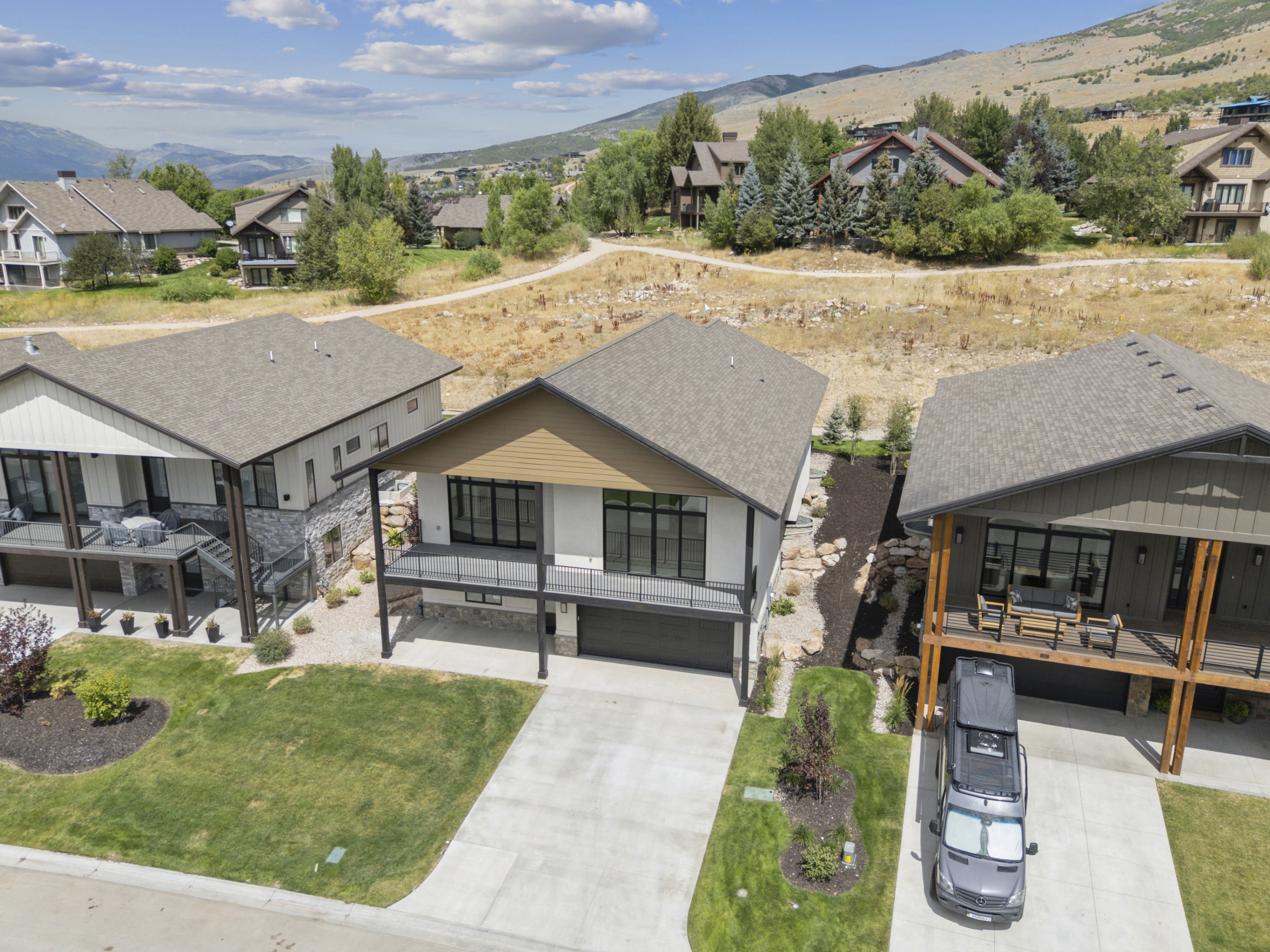 View of front facade with a south view of Snowbasin and Pineview reservoir.