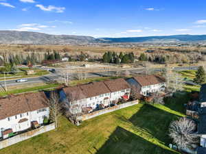 Aerial perspective of suburban area featuring a mountainous background