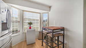 Dining area featuring light wood-type flooring and baseboards