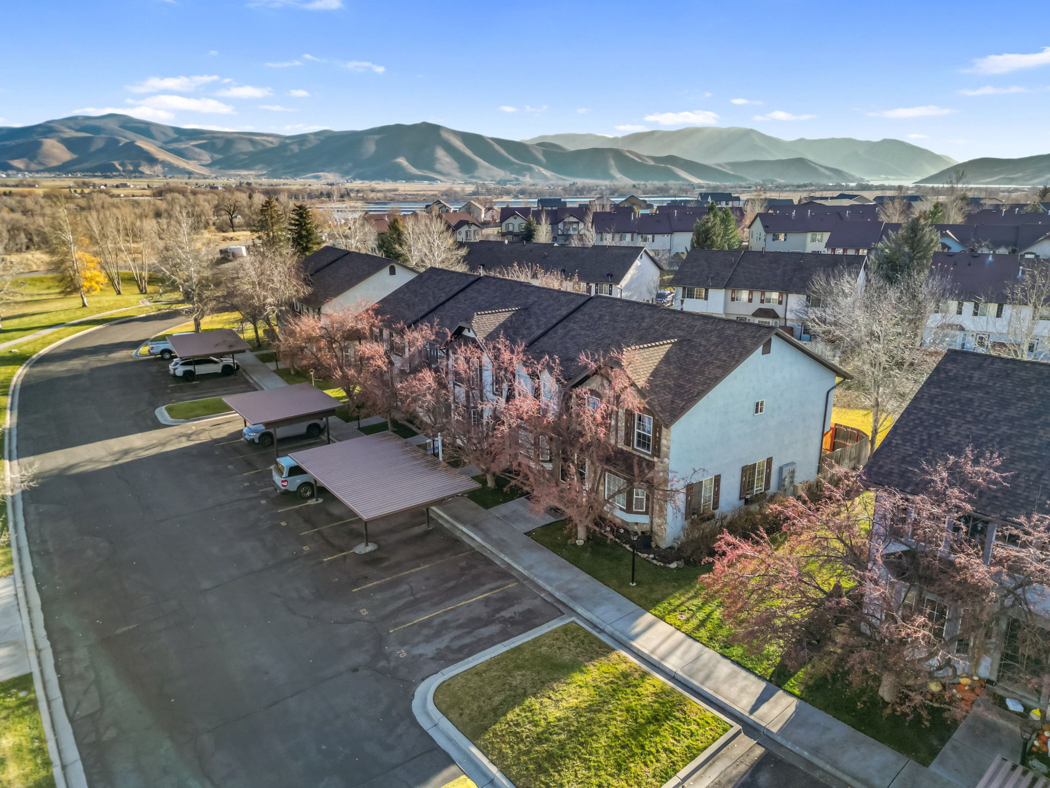 Aerial view of residential area featuring a mountainous background
