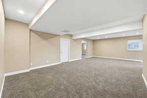 Basement featuring recessed lighting and carpet flooring