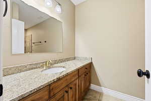 Bathroom featuring vanity and light tile patterned flooring