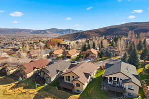 View of property location with nearby suburban area and mountains