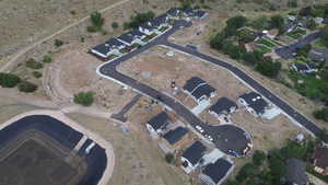 Aerial view of property's location featuring nearby suburban area