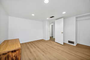 Unfurnished bedroom with recessed lighting and light wood-style floors