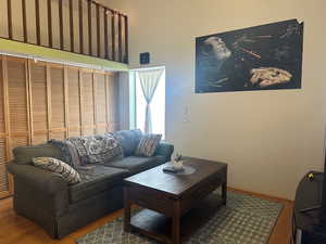 Living area featuring wood finished floors and baseboards