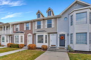 View of front of property with a front lawn