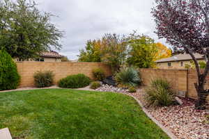 View of fenced backyard