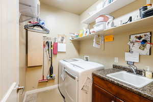 Laundry room with washer and dryer and cabinet space