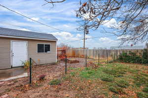 Fenced yard with a vegetable garden