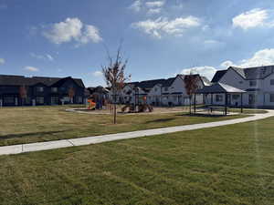 View of grassy yard with a gazebo, a residential view, and a patio