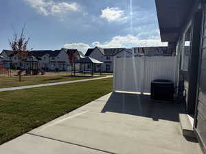 View of patio with a gazebo, a residential view, and a playground