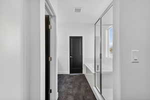 Hall featuring baseboards