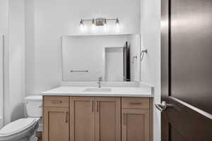 Bathroom with vanity and toilet