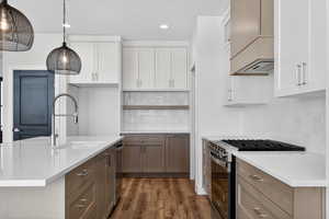 Kitchen featuring appliances with stainless steel finishes, white cabinets, open shelves, dark wood-style flooring, and recessed lighting