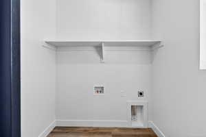 Laundry room featuring hookup for an electric dryer, wood finished floors, and hookup for a washing machine