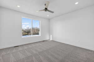 Carpeted empty room with recessed lighting and a ceiling fan