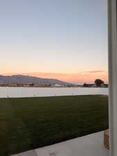Fenced backyard featuring a mountain view