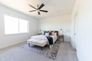 Bedroom featuring light carpet and ceiling fan