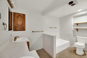 Bathroom with double vanity and a garden tub