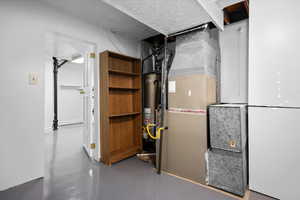 Utility room with heating unit and gas water heater
