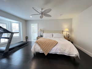 Primary bedroom with ensuite bath, wood floors and French Doors leading to private patio