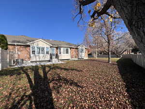 Rear view of house with large, open greenbelt area