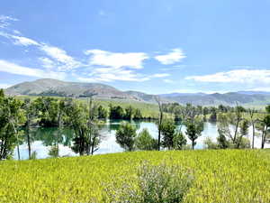 View of mountain background featuring a nearby body of water