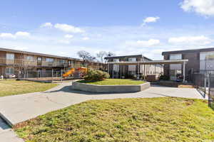 View of community featuring a patio and a pergola